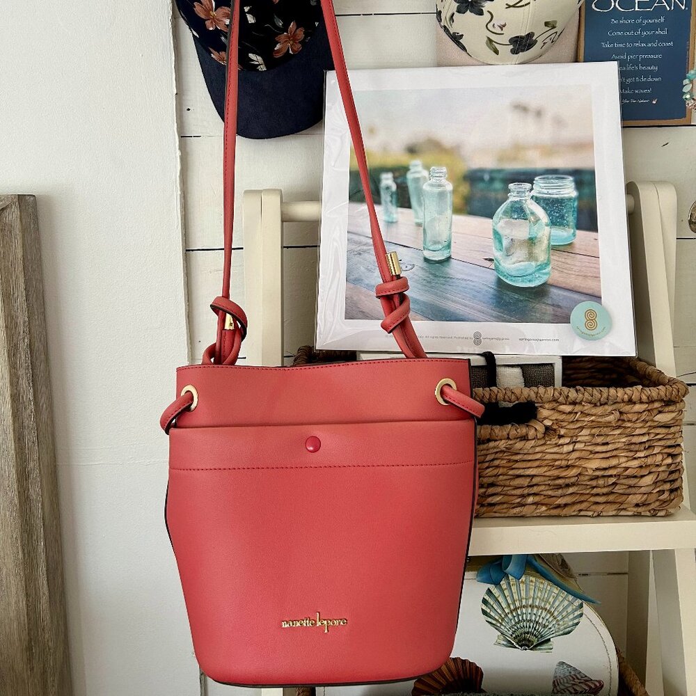 Pink bucket style Nanette Lepore handbag with adjustable shoulder strap